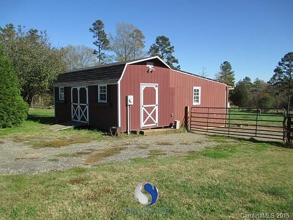 Water & electric to enclosed live stock shelter.