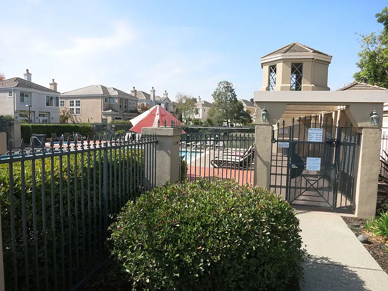 Gated entrance to community pool and spa