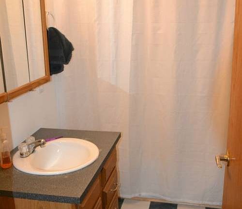 The bathroom is off of the main living area.  It has a tub/shower combo and easy access from all of the rooms.