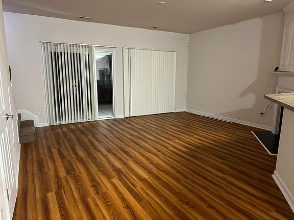 Chic and spacious 1600 sq ft townhouse living room_where comfort meets style. Unwind in this contemporary haven flooded with natural light, offering the perfect blend of relaxation and modern aesthetics. Your ideal living space awaits.