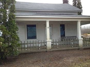 A front view of the porch with a swing for those summer nites.