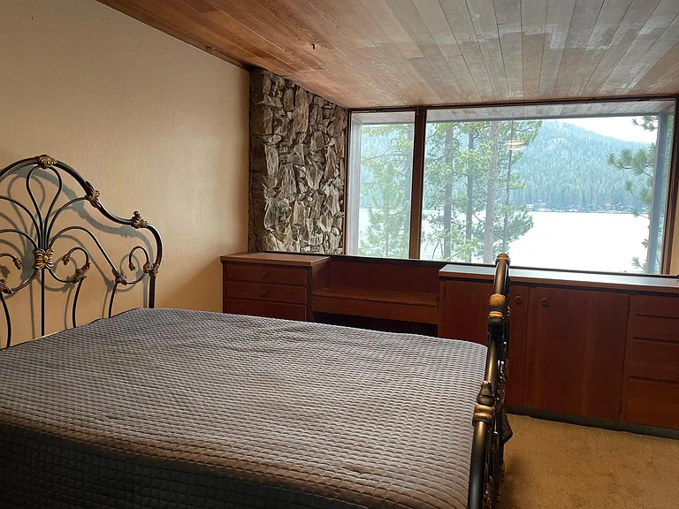 Master with lake view and built-in drawers and shelfs