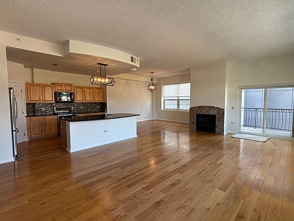 Great room with view of the kitchen and dining room.