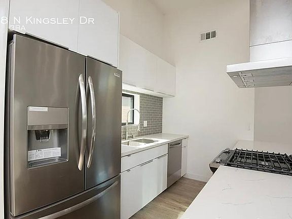 Kitchen features stainless steel appliances.