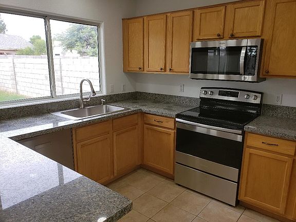 Kitchen. Blinds have been added to window