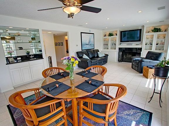 Eating area off kitchen & family room with custom built-ins