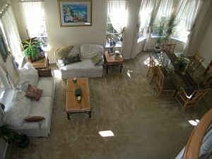 Living room & dining area with soaring ceilings