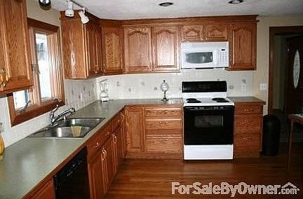 Oak cabinet kitchen w oak floor						:						New in 2007.Room for addl cabinets.Microwave & dishwasher included.
