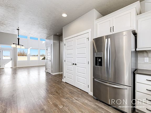 Kitchen leading into dining area and living room