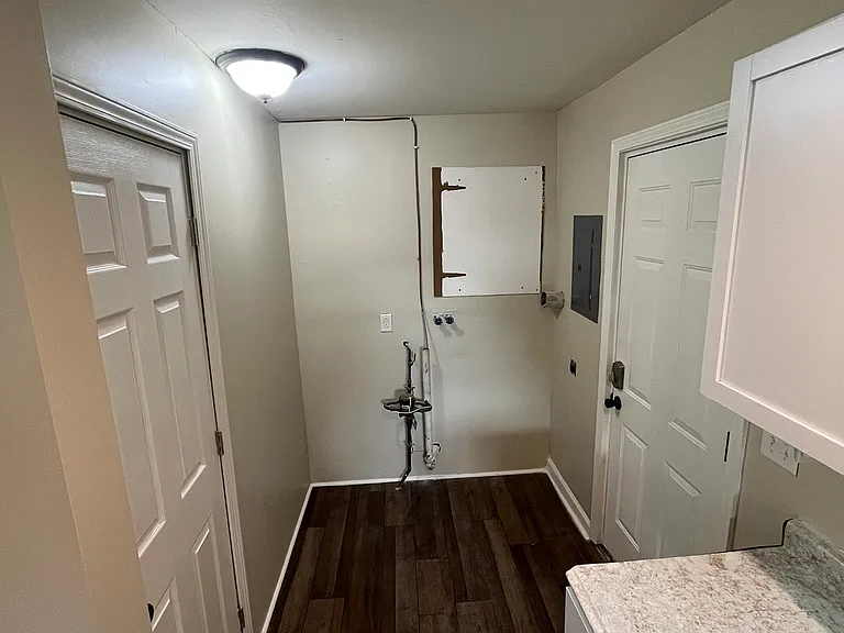 Laundry hook up & side door