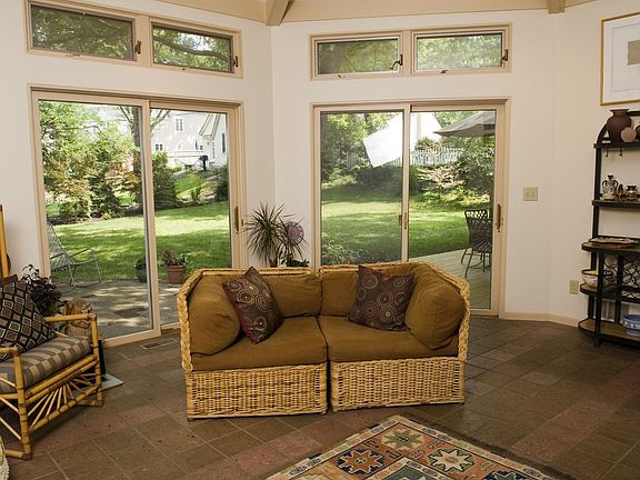 Family room off kitchen has 3 sets of sliding doors to expansive, private yard