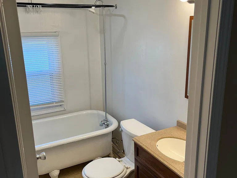 Second floor bathroom, view 1 - cast iron soaking tub.