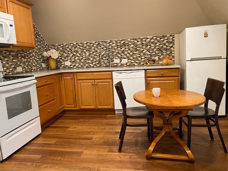 full kitchen with granite countertops and dishwasher