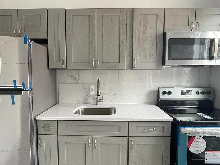 kitchen with brand cabinets and new stainless steel appliances
