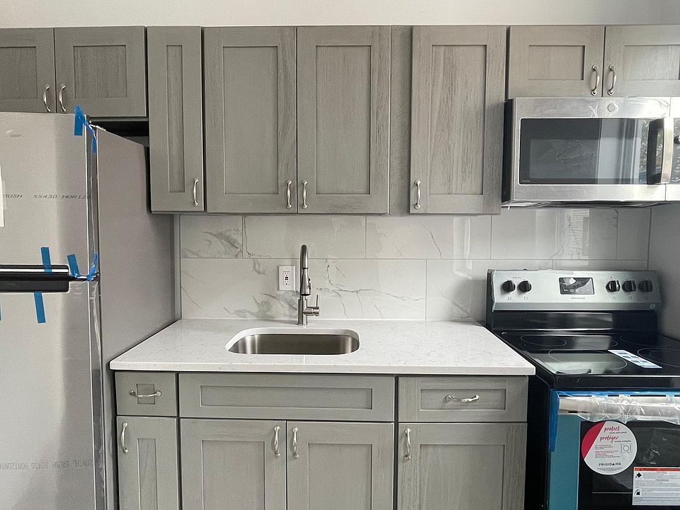 kitchen with brand cabinets and new stainless steel appliances