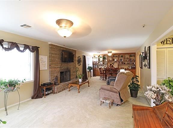 Living Room Combo with Dining with extra light from southern windows.  Fireplace w/ gas starter & insert.