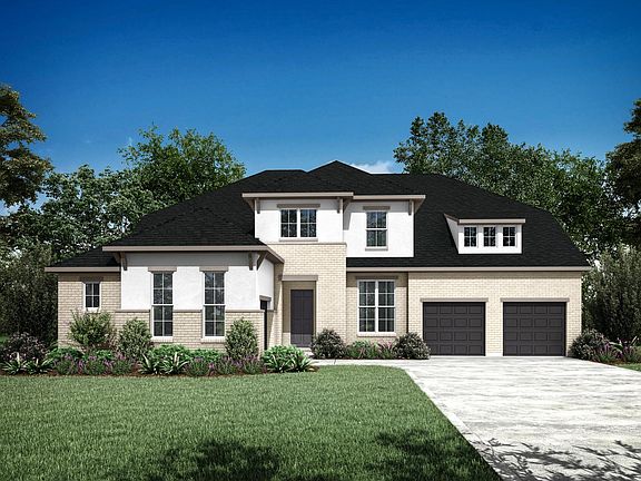 custom home with brick and stucco