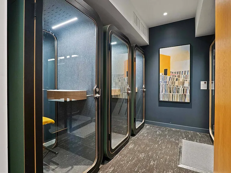 Utilize a compact booth, offering a private, focused space for work.
