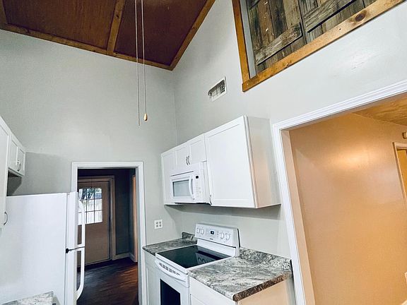 Beautiful vaulted ceilings in kitchen, laundry room and bathroom