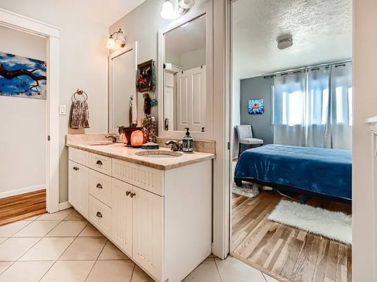 Upper master bath with dual sinks, shower and tub newly updated