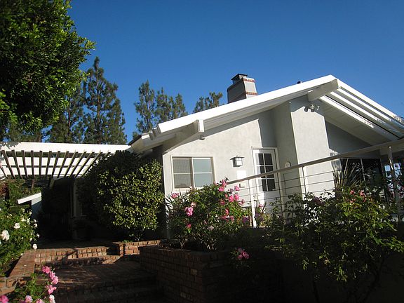 3 patio covers around house