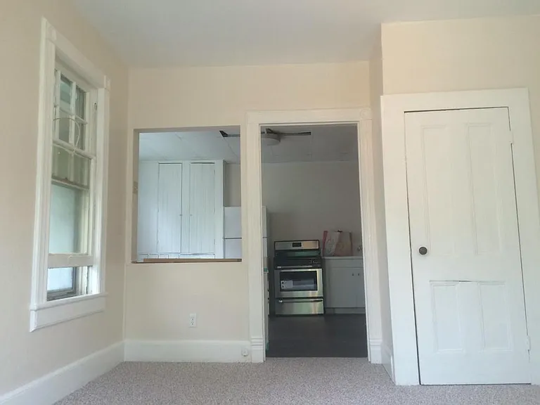Living room, looking toward kitchen.