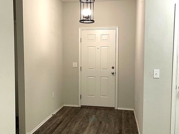 Front door, beautiful chandelier at the entrance.