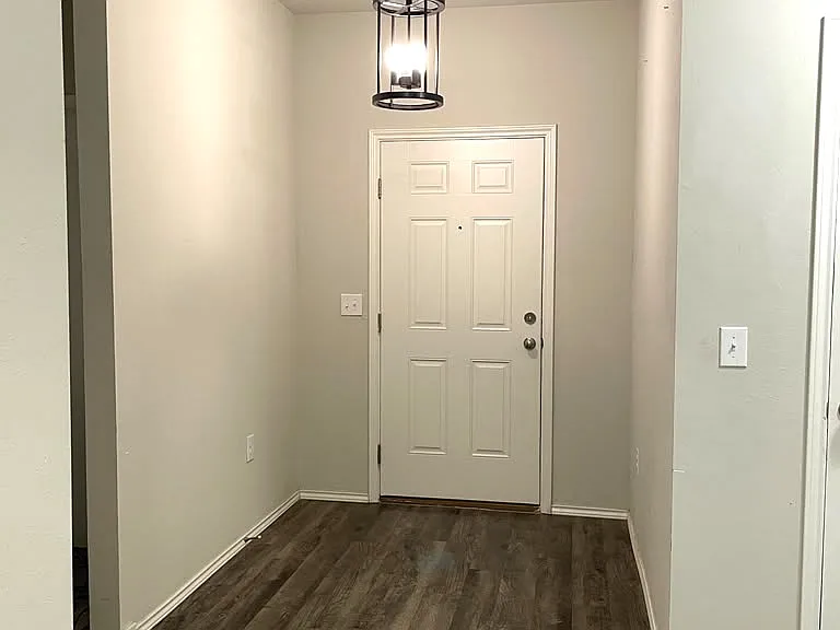 Front door, beautiful chandelier at the entrance.