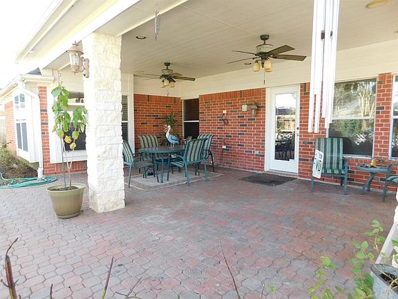 Covered patio is prewired for TV and surround sound.