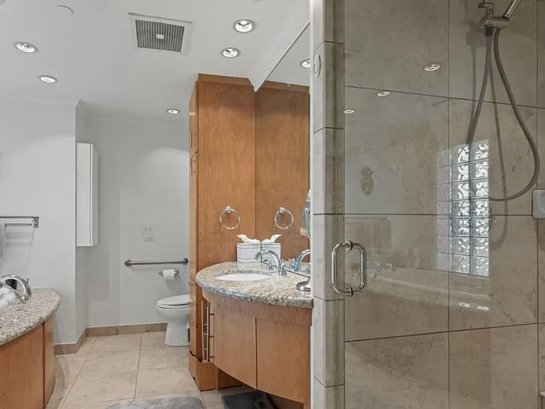 Master bath - large custom shower with seat, jacuzzi tub and storage