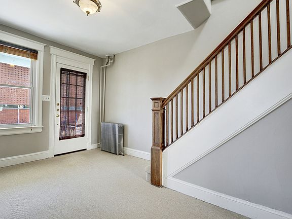 Entry with Wood Balustrade