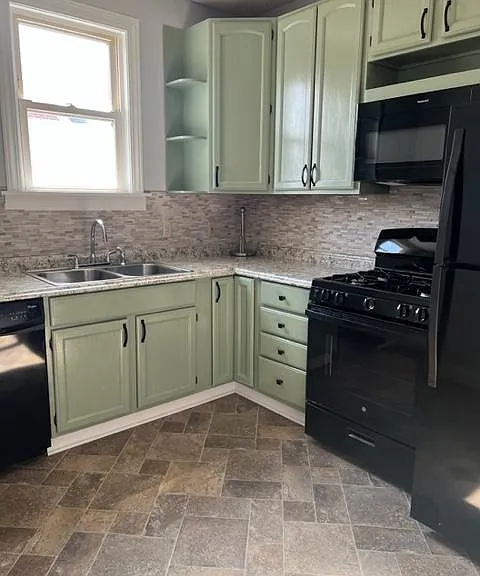 Freshly painted with new countertops and backsplash. New microwave and refrigerator