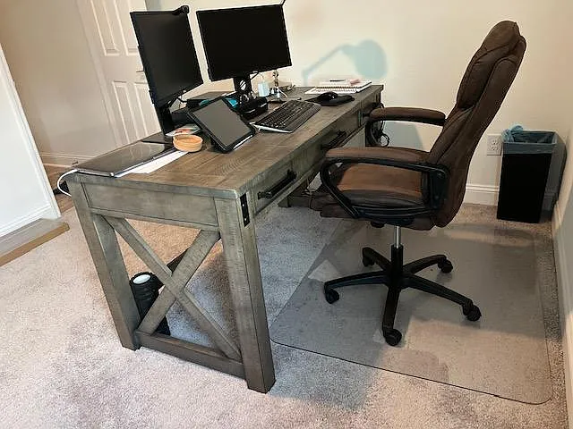 One bedroom is a home office with this height adjustable desk. There is also a sofa sleeper in the office.