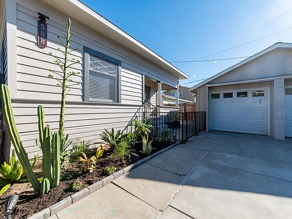 Front of house with the dedicated garage for personal use.