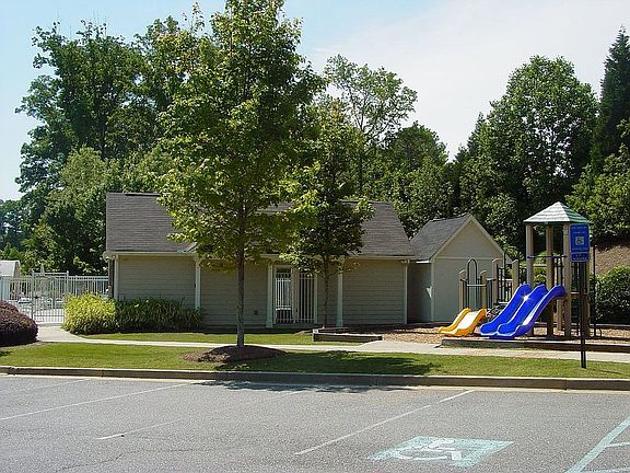 Neighborhood features pool and cabana plus playground with swings