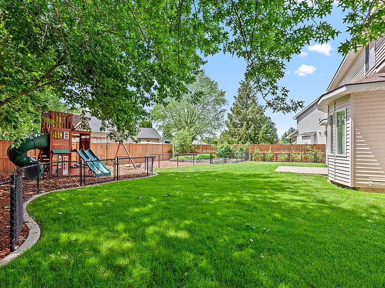 Large Backyard with Garden and Play Structure