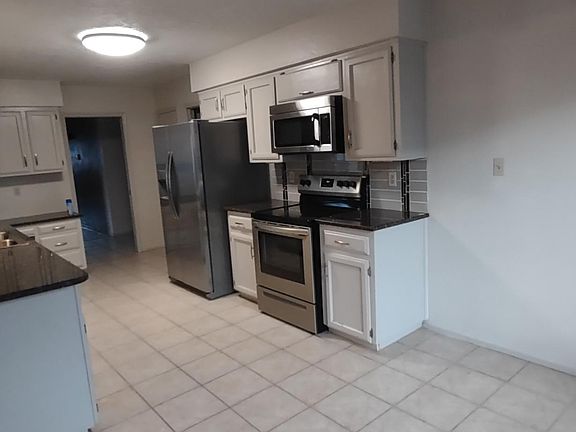 Kitchen from eat in area of great room