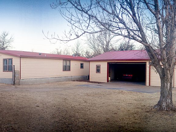 3 car garage & 4th bay