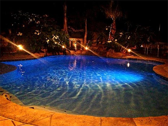 TAKE A DIP IN THIS GLISTENING POOL FEATURING LED LIGHTING FOR BEAUTIFUL NIGHT VIEWS