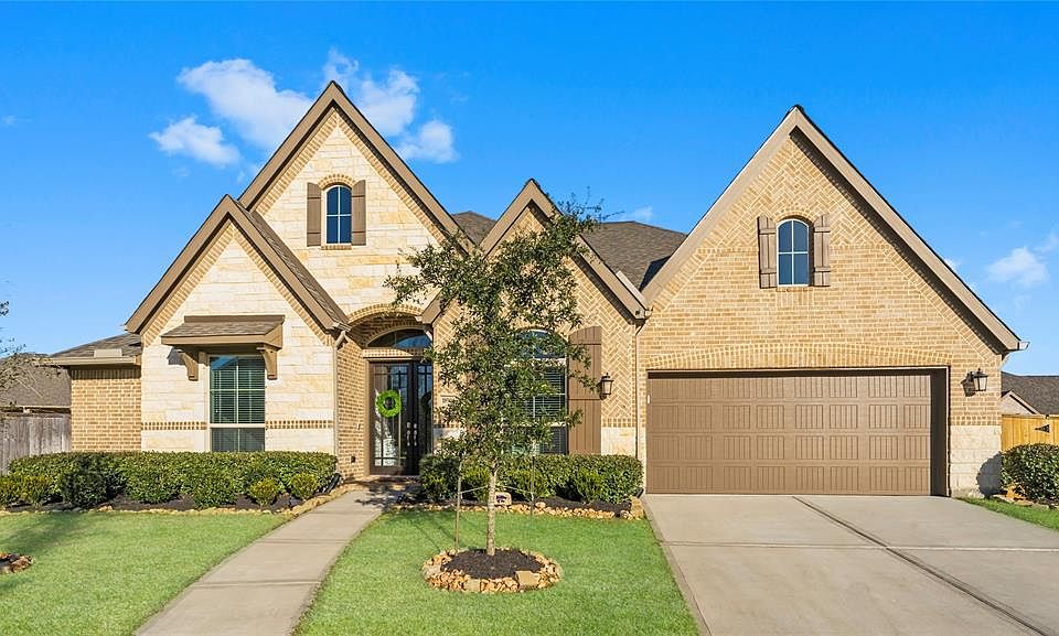 18906 Carson Glen - a gorgeous, move-in ready home in Tavola with exceptional curb appeal and 3 car tandem garage.