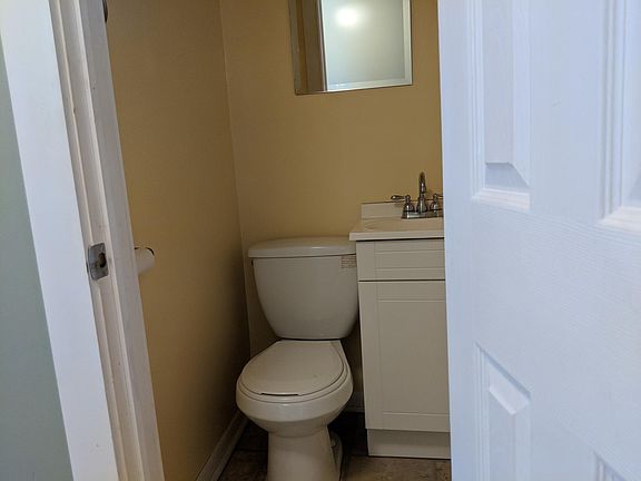 The first floor has a half bath right off the main hallway.