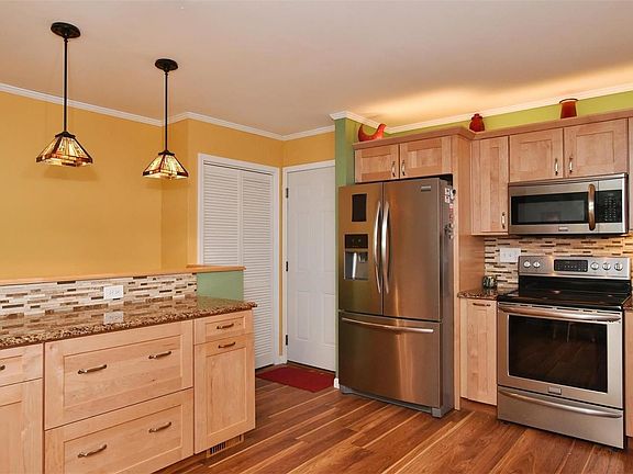 Another view of the newer kitchen -- more counterspace on the left with beautiful stained glass light fixtures.