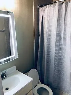 Master bathroom includes newly installed LED mirror vanity
