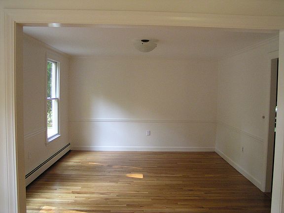 Dining room - windows East, open to Living room with doorway to kitchen