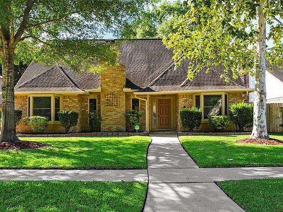 Street view front facing 10107 Rippling Fields Dr.