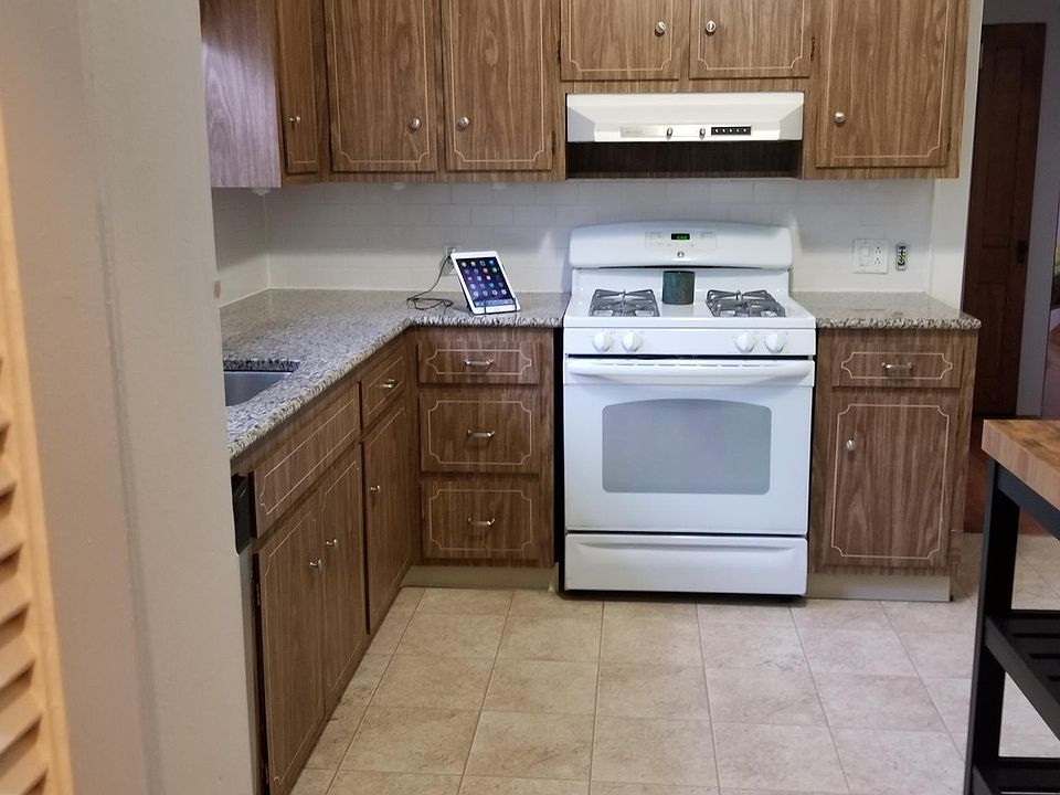 L-shaped kitchen with pantry, refrigerator, dishwasher, self cleaning gas stove and island. Loads of room.