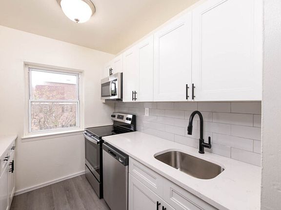 Elevate your cooking experience in the modern kitchen at Parkside Apartments, featuring sleek stainless steel appliances and ample natural light. This stylish space is perfect for culinary adventures. Schedule a tour today to see it for yourself!