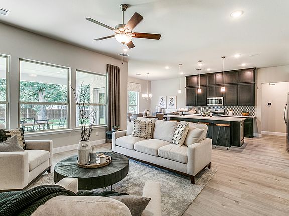 Living room and kitchen of Stone Eagle home in Azle, TX by Kindred Homes