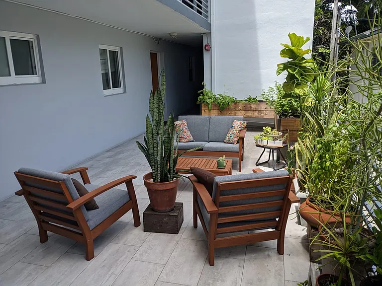 Deck in front of the apartment. The apt is the one showing in the picture (windows and door).