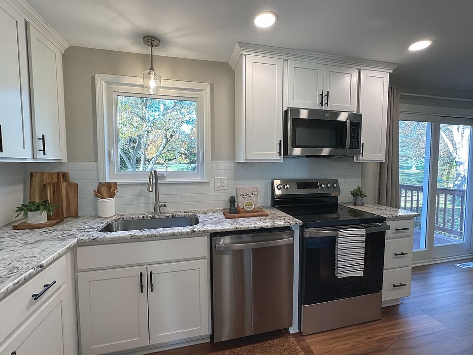 Newly designed kitchen. Stainless appliances with granite countertops